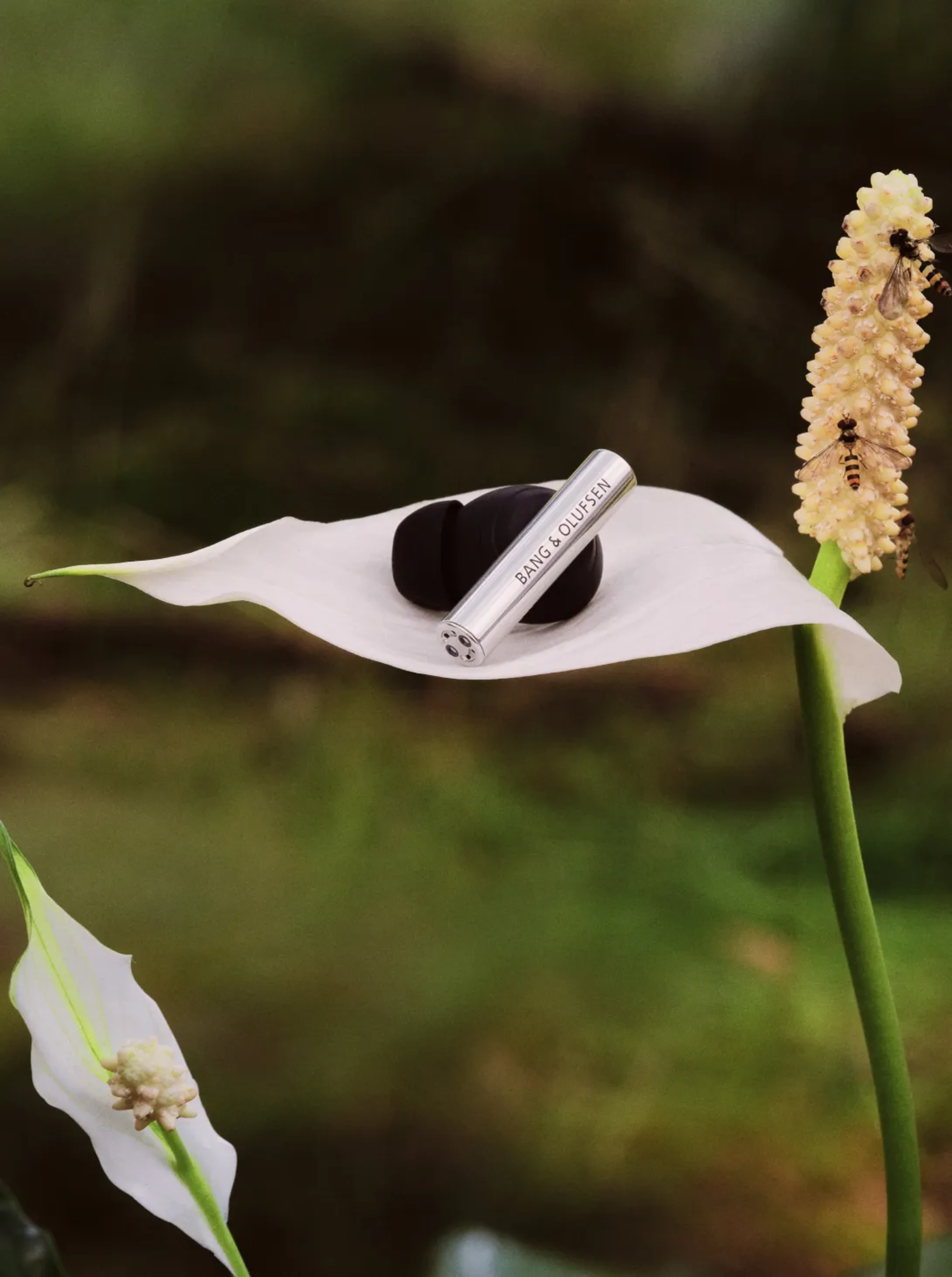 Beo Grace earphone on a big flower leaf showing how light it is
